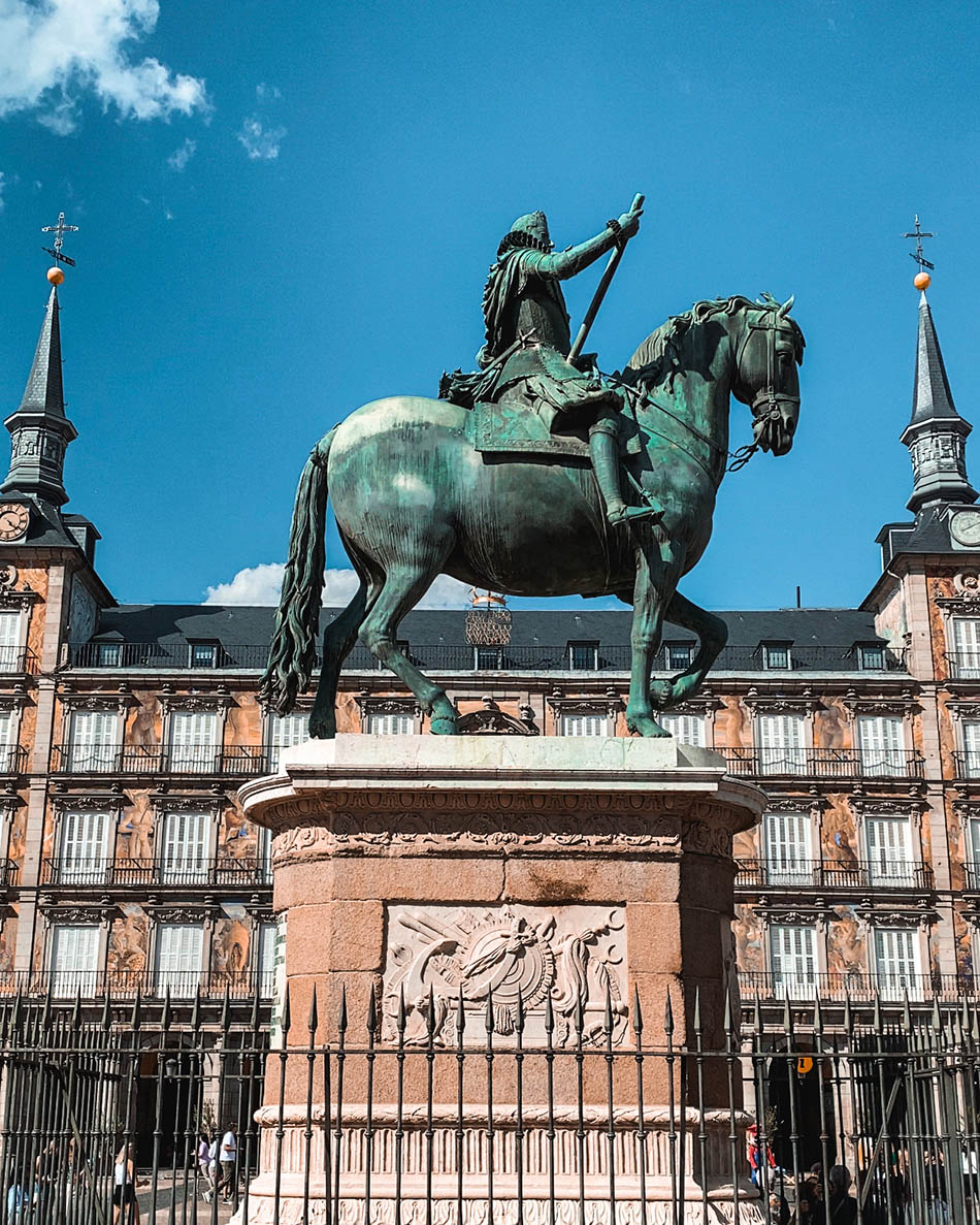 statue in madrid's plaza mayor