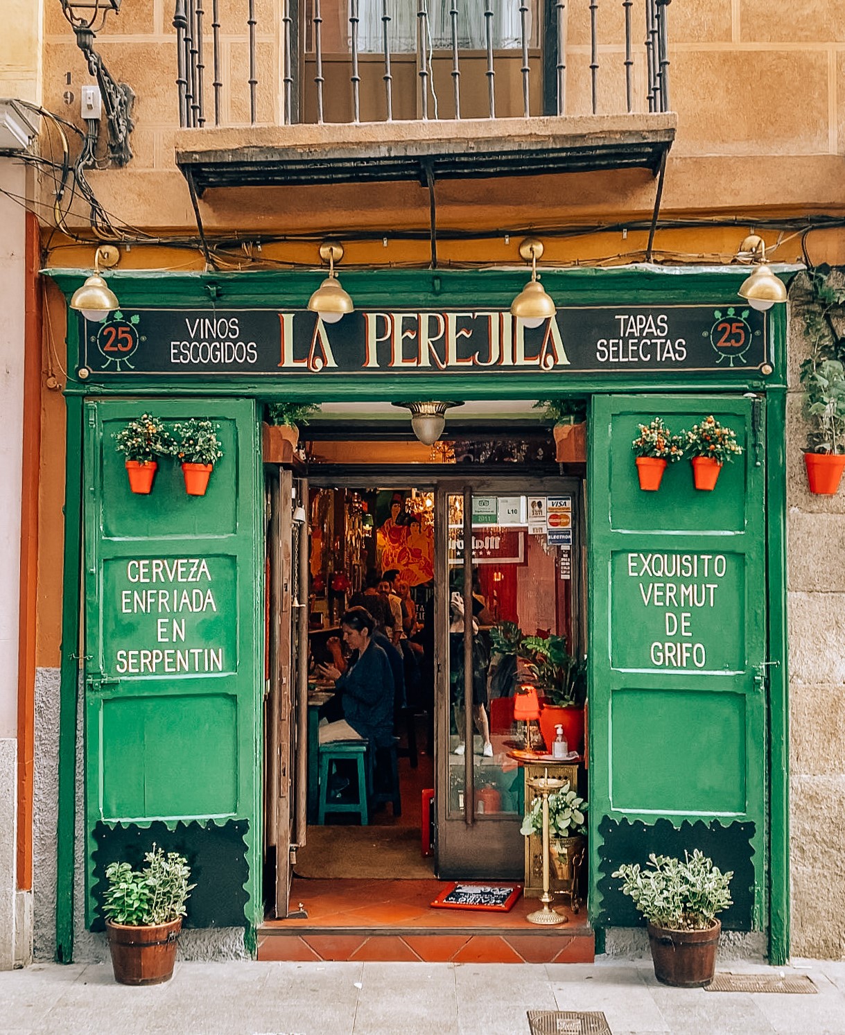 Cava Baja Tapas bar with green exterior and red font