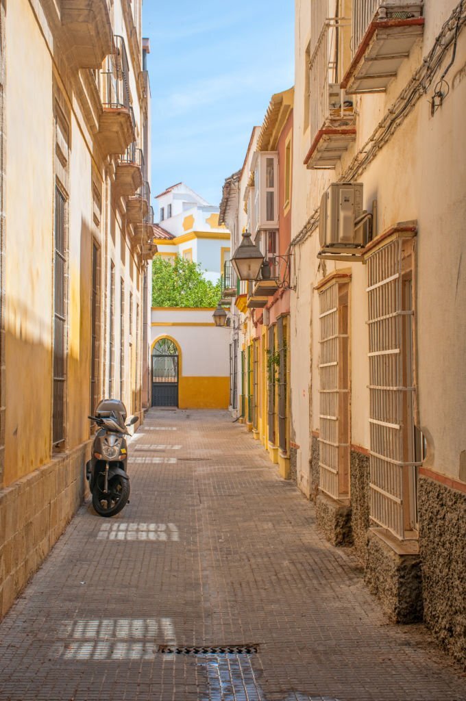 Streets of Seville Spain with yellow buildings