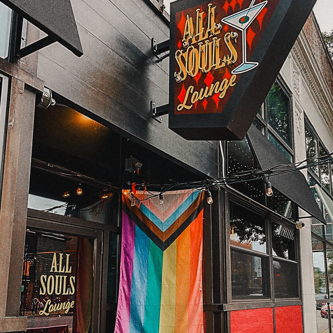 all soul's lounge black signage with retro martini glass