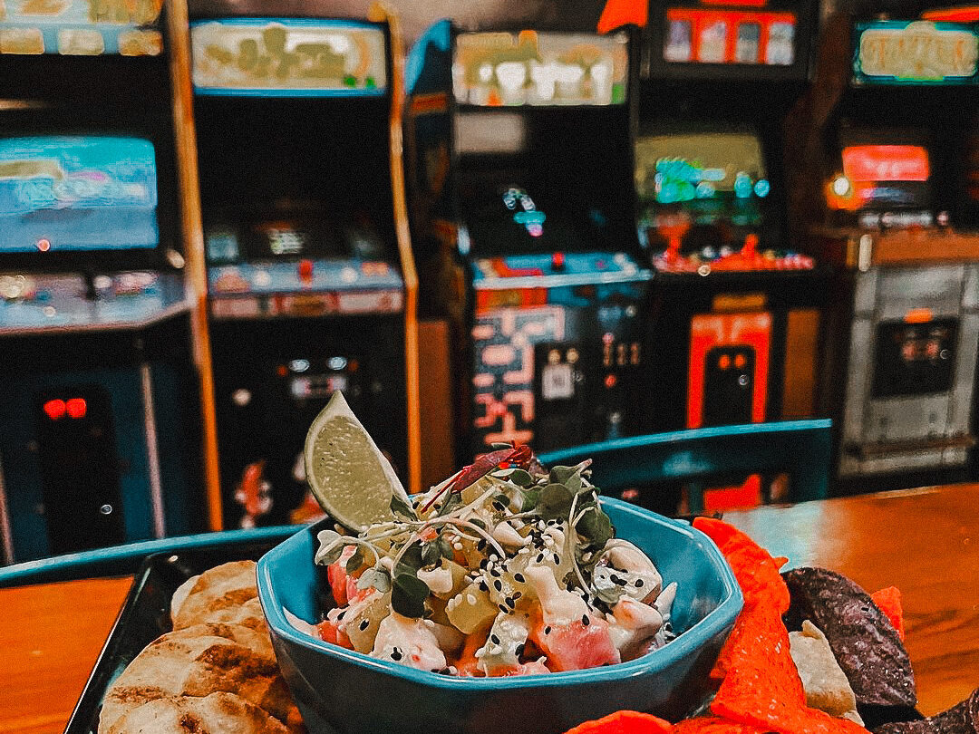 ahi poke in front of bit bar arcade machines