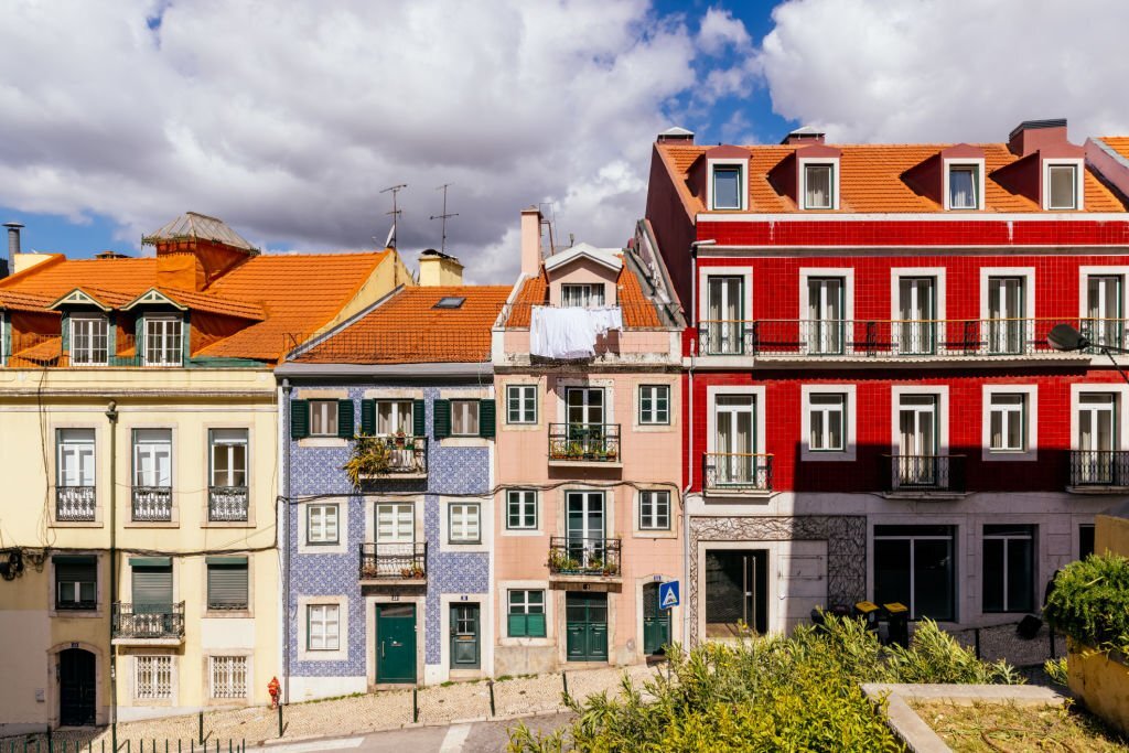Colorful facades along a narrow Lisbon street in spring