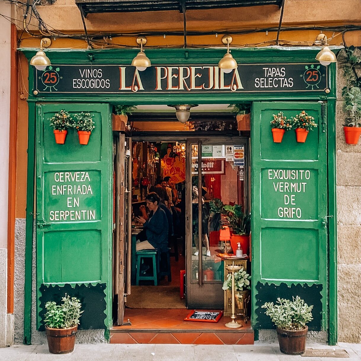 Cava Baja Tapas bar with green exterior and red font