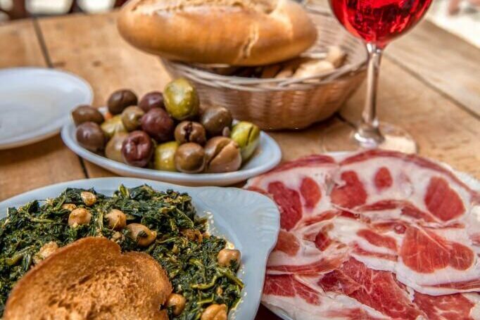 spanish tapas on table to share at a food tour