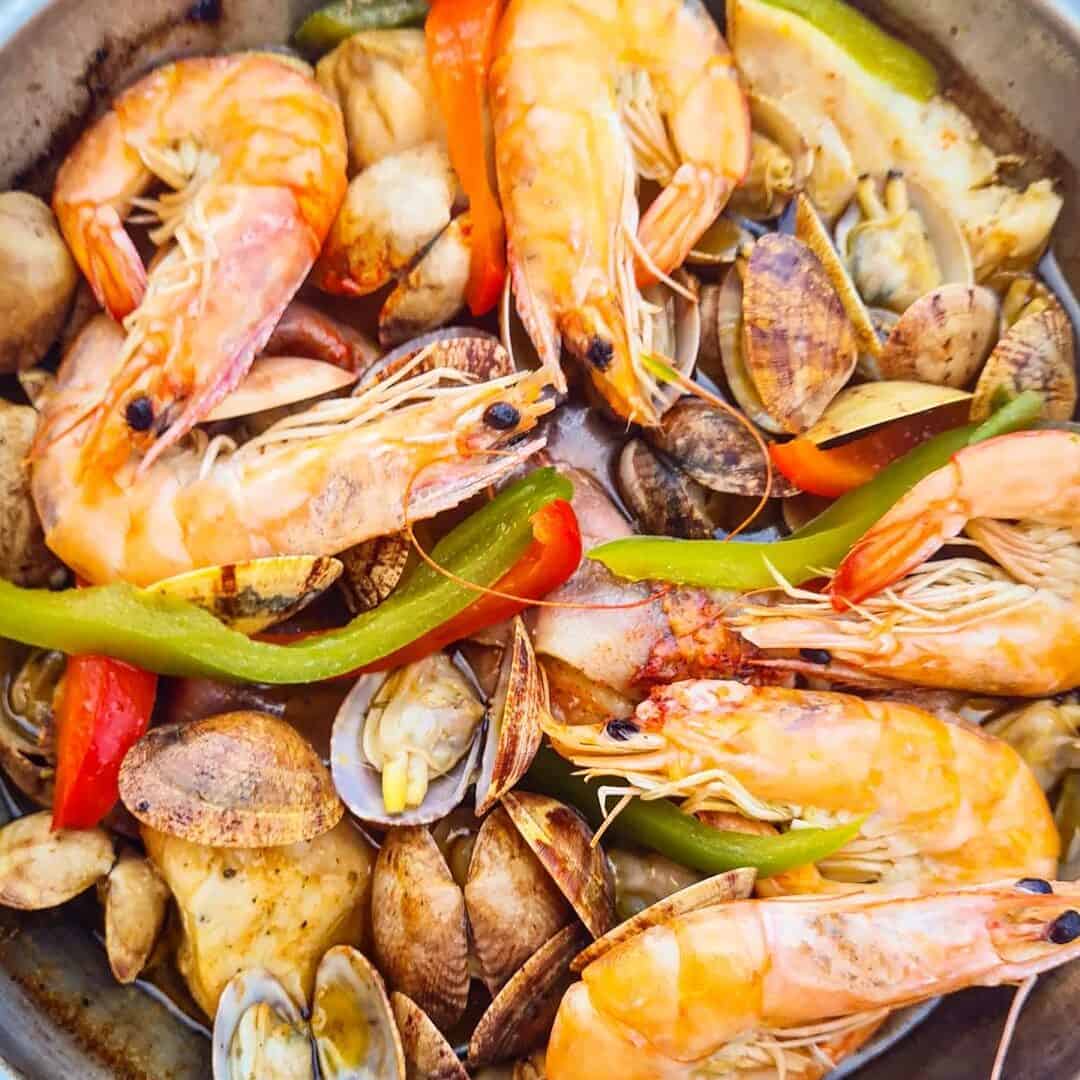 seafood and vegetables in cataplana de marisco