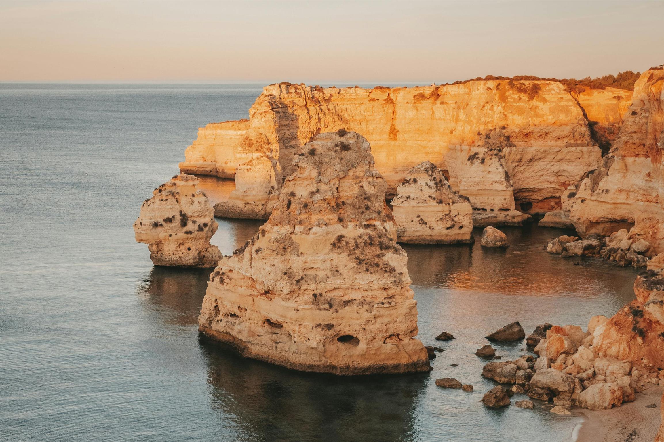 golden cliffs of algarve coast against the blue ocean